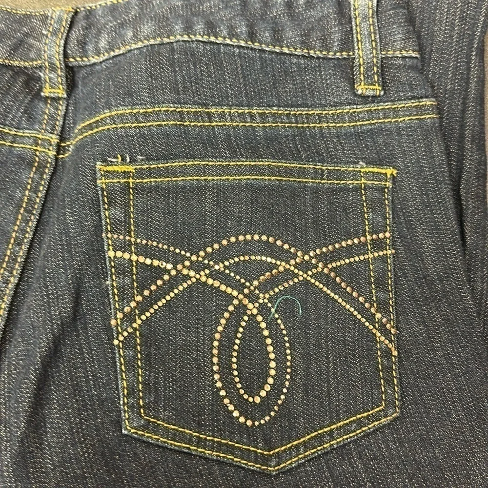 94.  Michael Kors dark blue skinny jeans with embellished pockets size 4